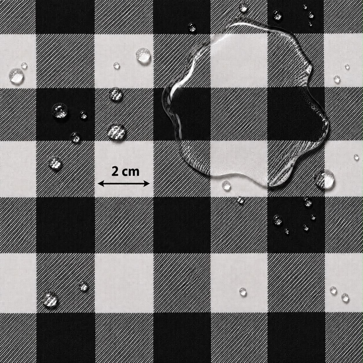 Black and white buffalo plaid fabric with water droplets on a white background and a '2 cm' scale marker.