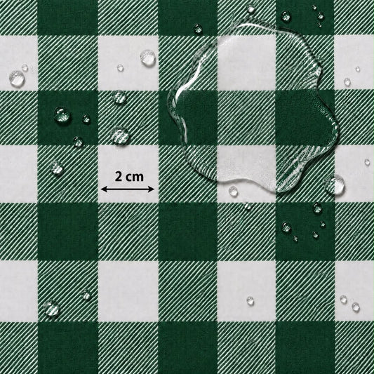 Green and white checkered fabric surface with water droplets and a large puddle on top, plus a small '2 cm' scale marker.