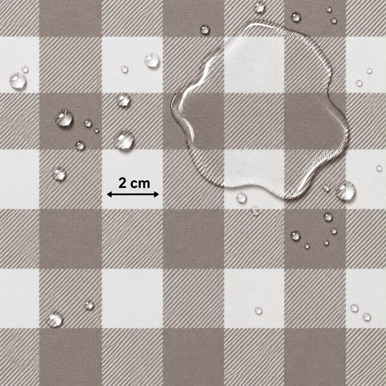 A close-up of a brown and white buffalo plaid fabric surface with water droplets and a clear liquid puddle on top, plus a black measurement arrow labeled 2 cm.