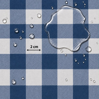 Blue and white checkered fabric surface with water droplets and a clear puddle on top, plus a small '2 cm' scale marker.