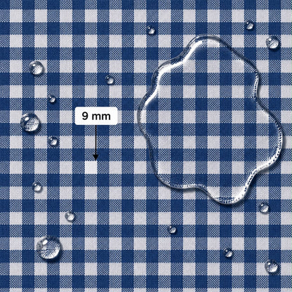 Blue and white gingham fabric surface with water droplets and a large clear water puddle, plus a label reading 9 mm indicating square width for scale.
