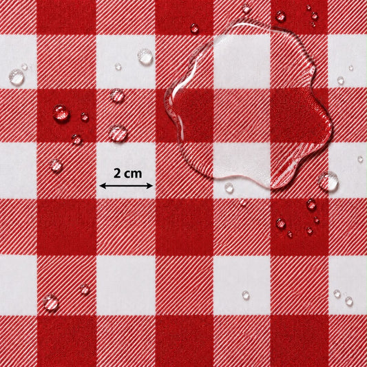 Red and white checkered fabric surface with water droplets and a transparent puddle of water, plus a small '2 cm' scale marker.