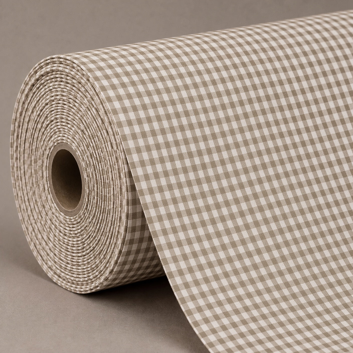 A roll of brown and beige gingham checkered wrapping paper or fabric, partially unrolled on a neutral gray background.