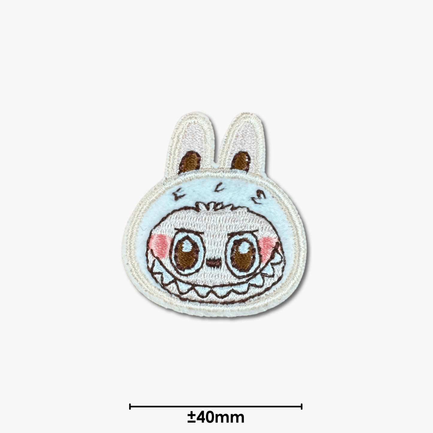 Motif Iron On Badge - Labubu Grin - Ragland Fabrics