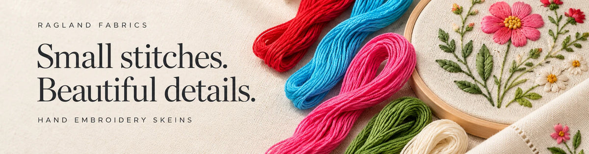 Colourful cotton embroidery skeins with a hand-stitched floral hoop and embroidered napkin. Small stitches. Beautiful details.