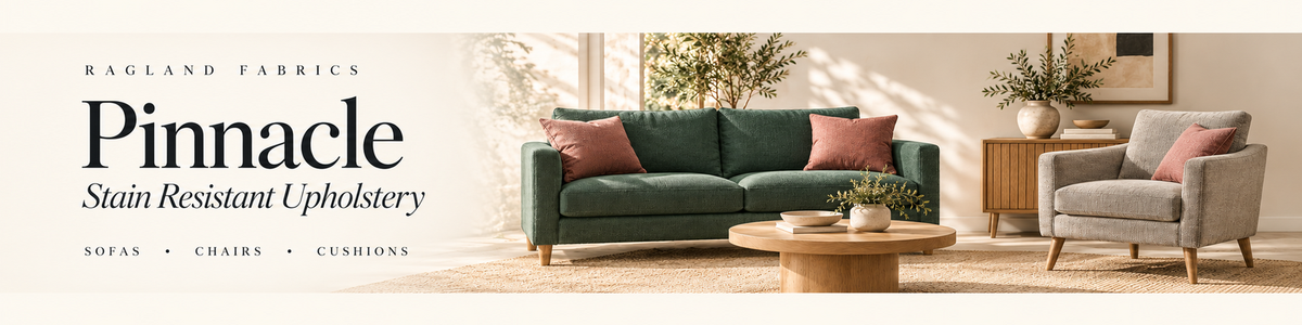 Pinnacle stain resistant upholstery shown on a green sofa, grey chair and rose cushions.
