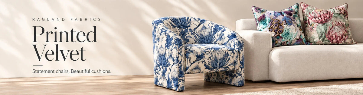 Printed velvet lifestyle inspiration with a Delft Protea armchair and floral scatter cushions