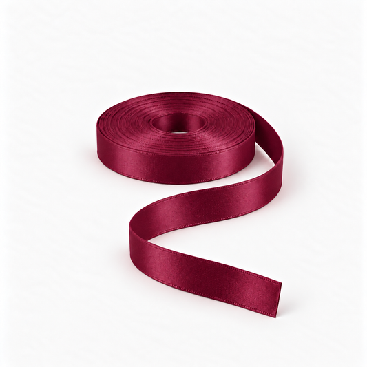 Satin Ribbon 15mm Maroon #123, flat coil with flowing S-shaped satin ribbon.