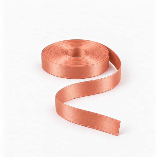 Satin Ribbon 15mm Peach #923, flat coil with flowing S-shaped satin ribbon.