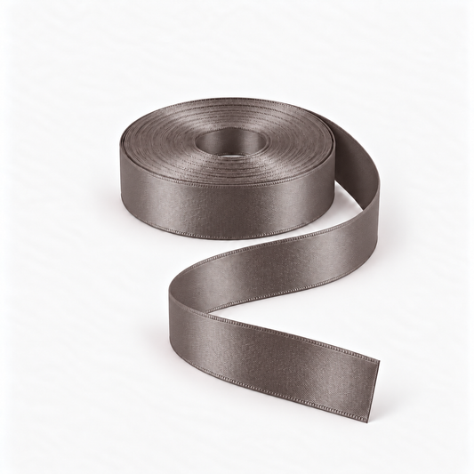 Satin Ribbon 25mm Dark Grey #3171, flat coil with flowing S-shaped satin ribbon.