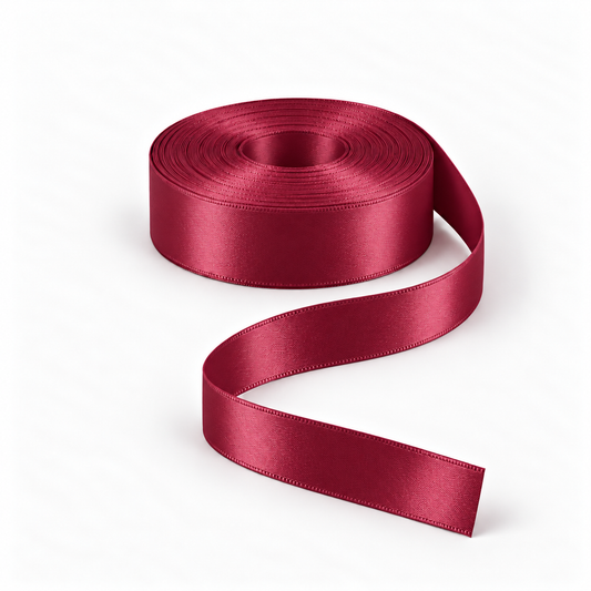 Ragland Fabrics satin ribbon 25mm, Maroon #123, broad ribbon roll and flowing ribbon on white.