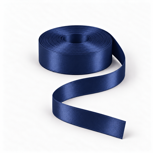 Ragland Fabrics satin ribbon 25mm, Navy #13, broad ribbon roll and flowing ribbon on white.
